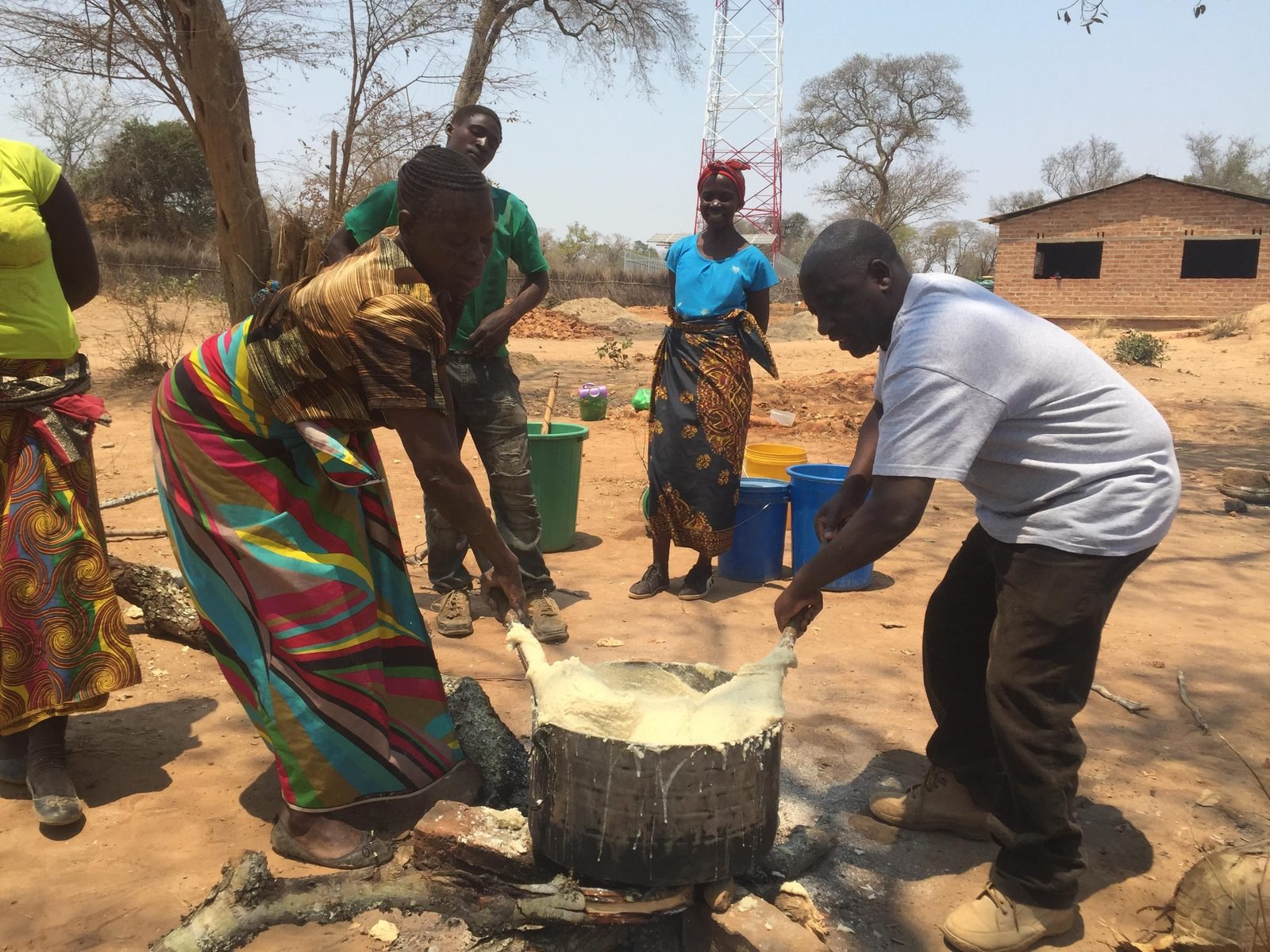 Community members of Simooya preparing food together