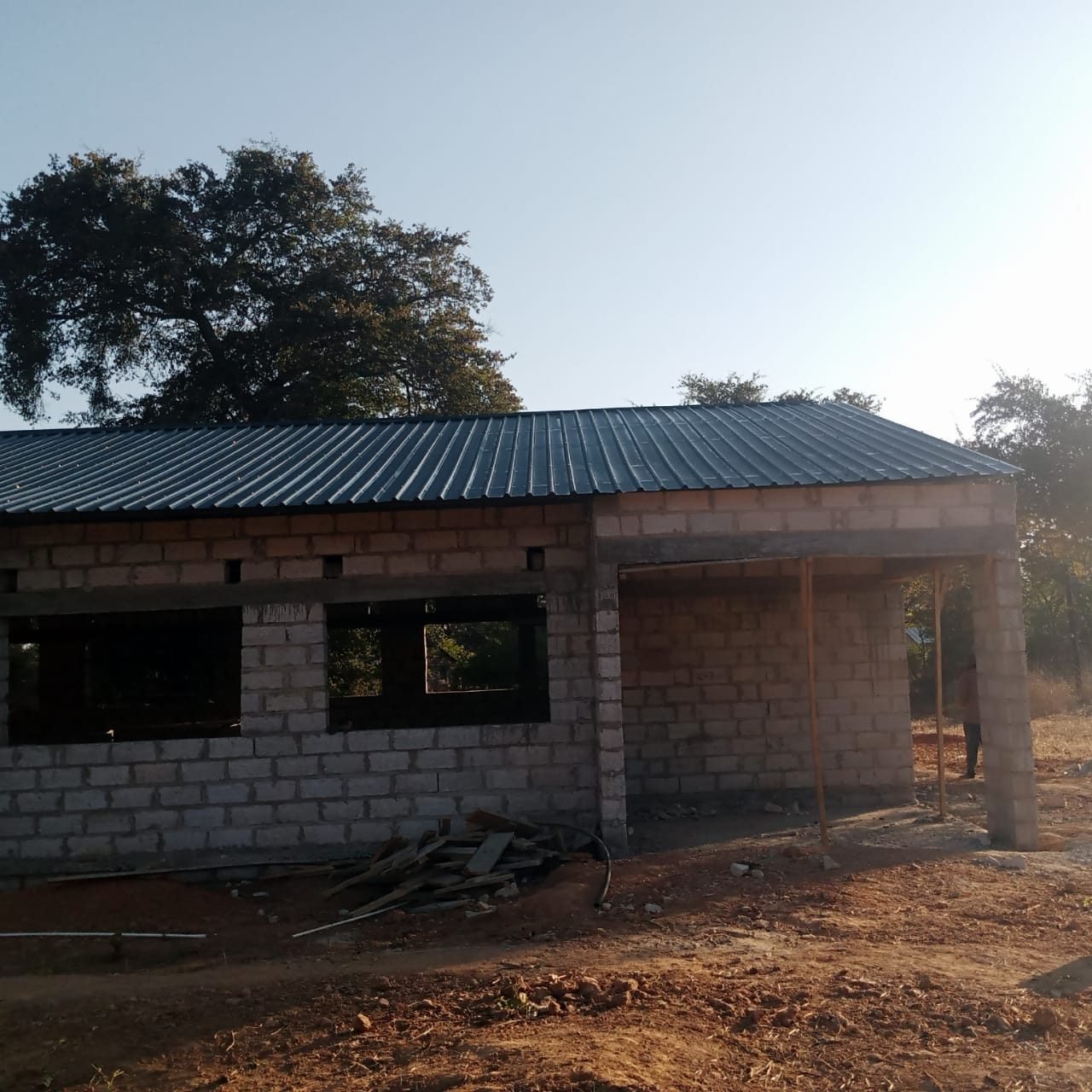 Corner view of the roofed building showing the veranda
