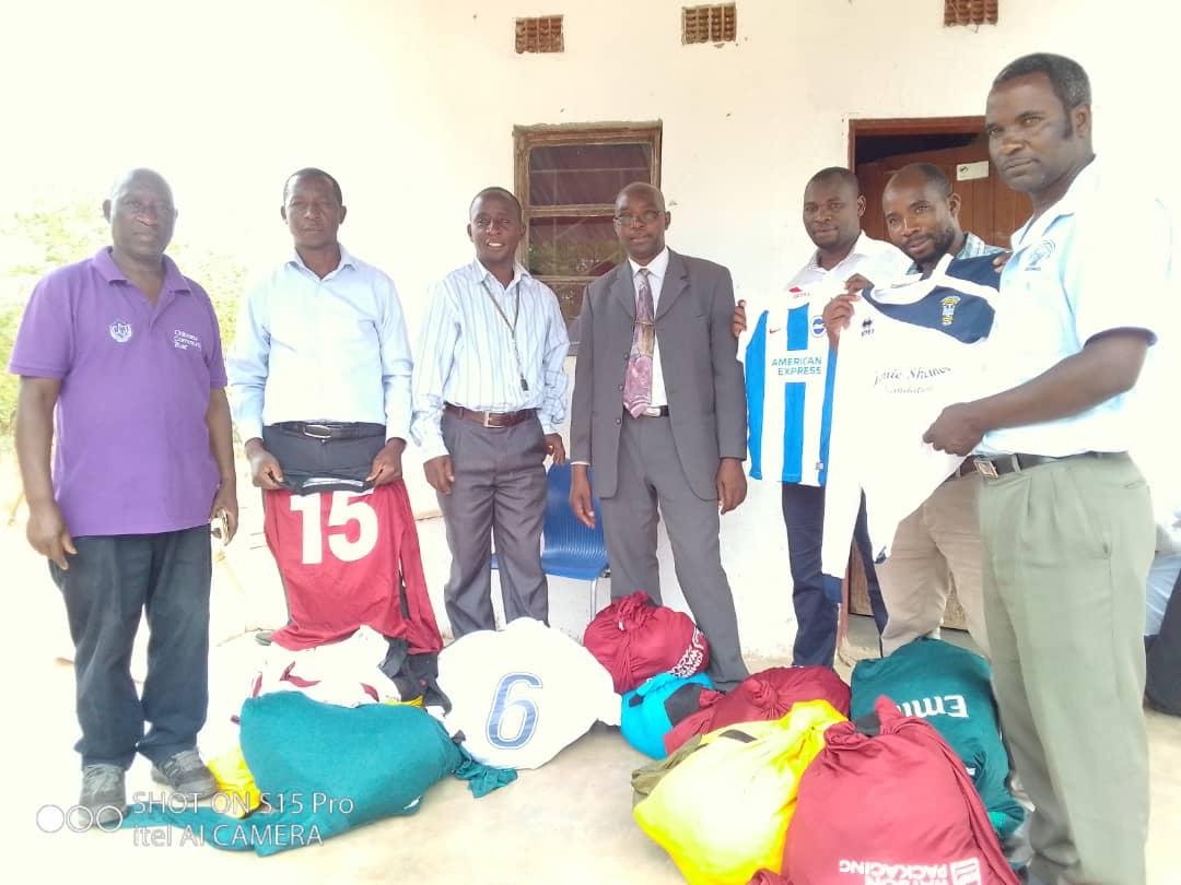 Community leaders receiving donated football kits
