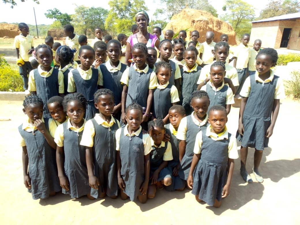 Pupils of Simooya Community Primary School with their teacher